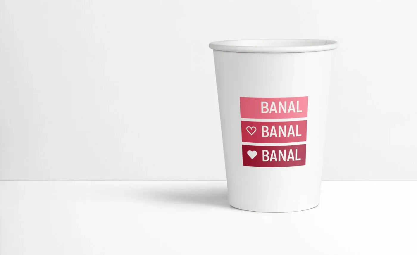 A paper cup with the word 'banal' on it