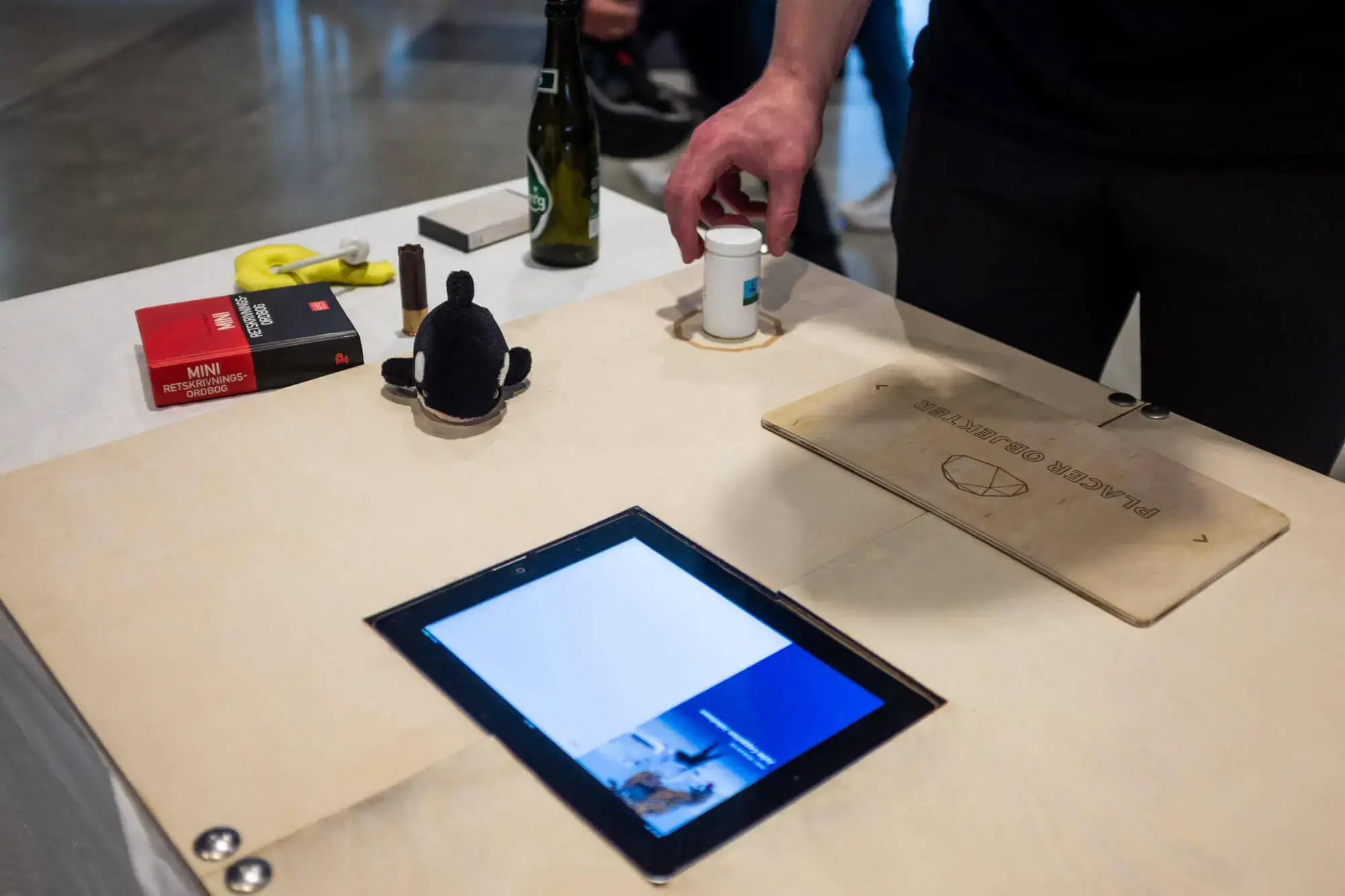 A desk where people could place objects to manipulate what's happinging for the person insite the filter dome